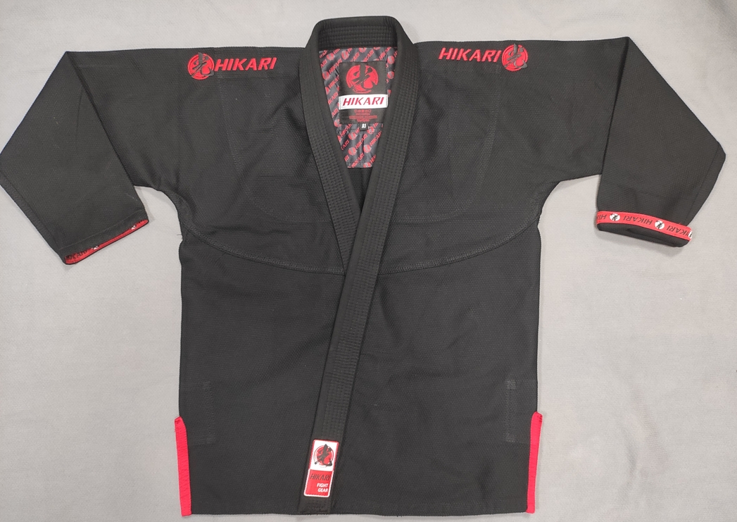 Black Hikari pearl weave gi with red shoulder embroidery and trim